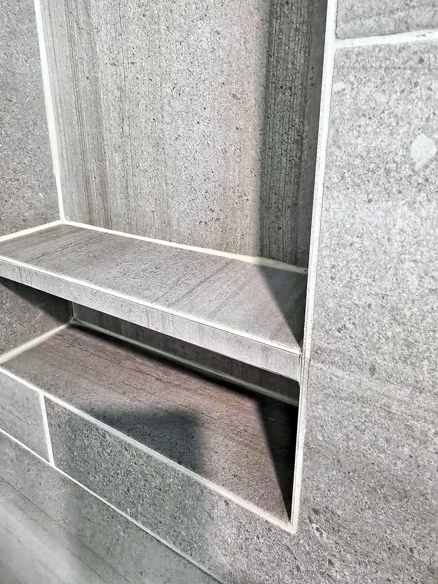 Close-up of the mitered front edge of a tile niche shelf in Ambler