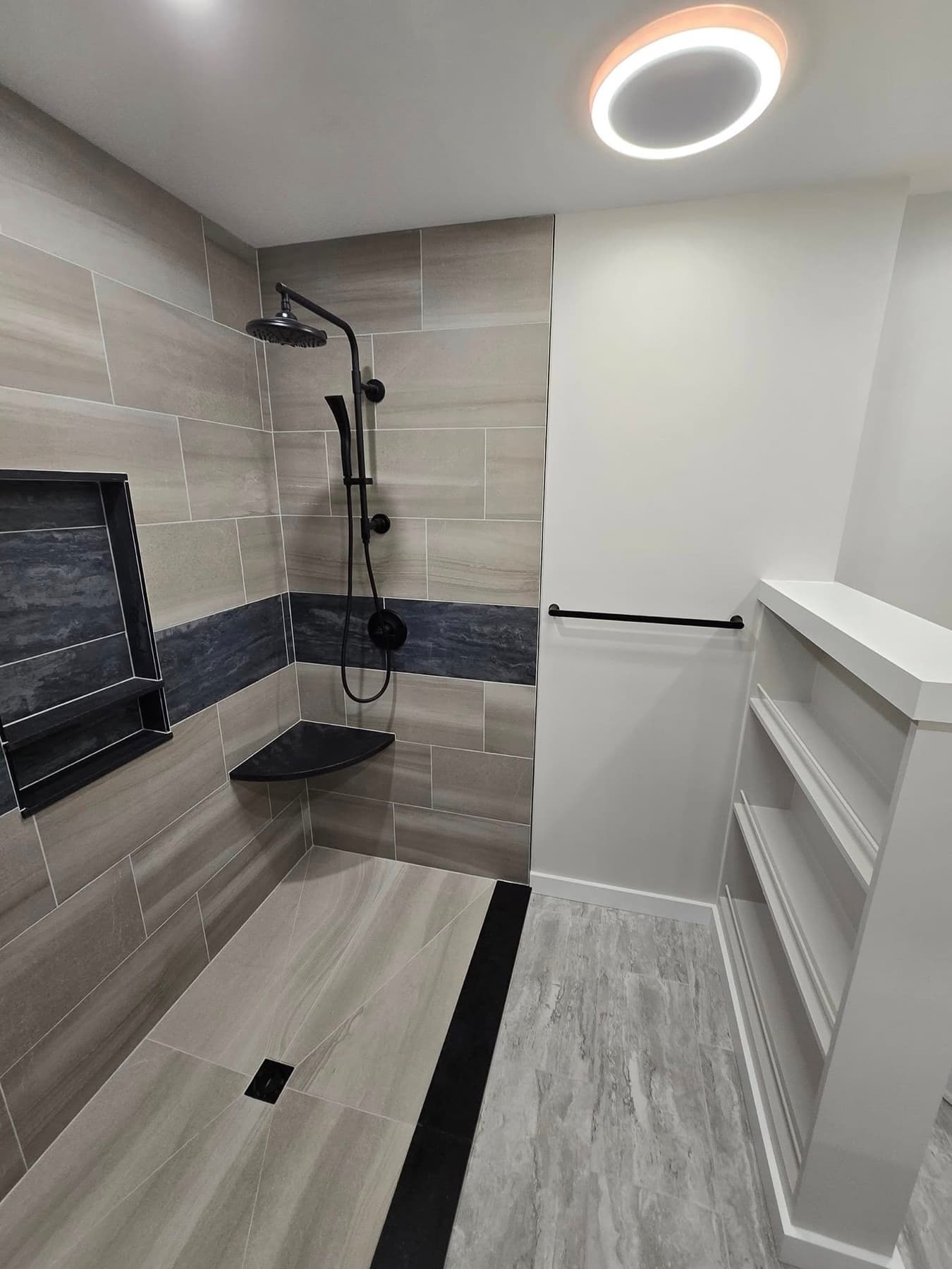 Shower with built-in storage from a bathroom remodel in Buckingham, PA