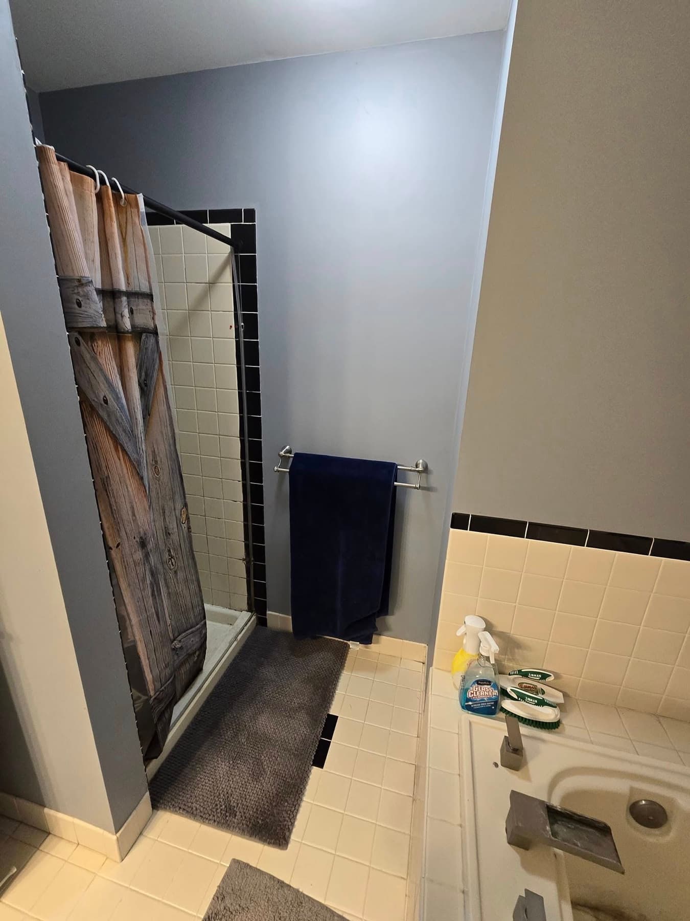 Original Buckingham bathroom shower area before remodeling