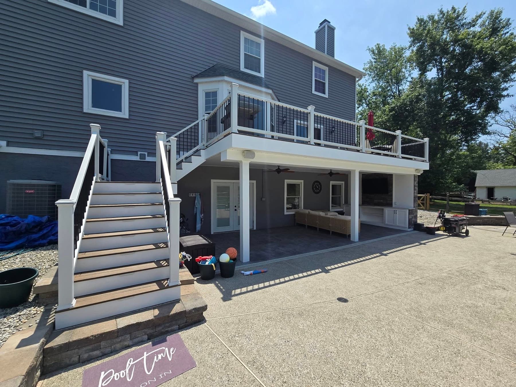 Raised deck, stairs, and covered patio from an outdoor living project in Doylestown, PA