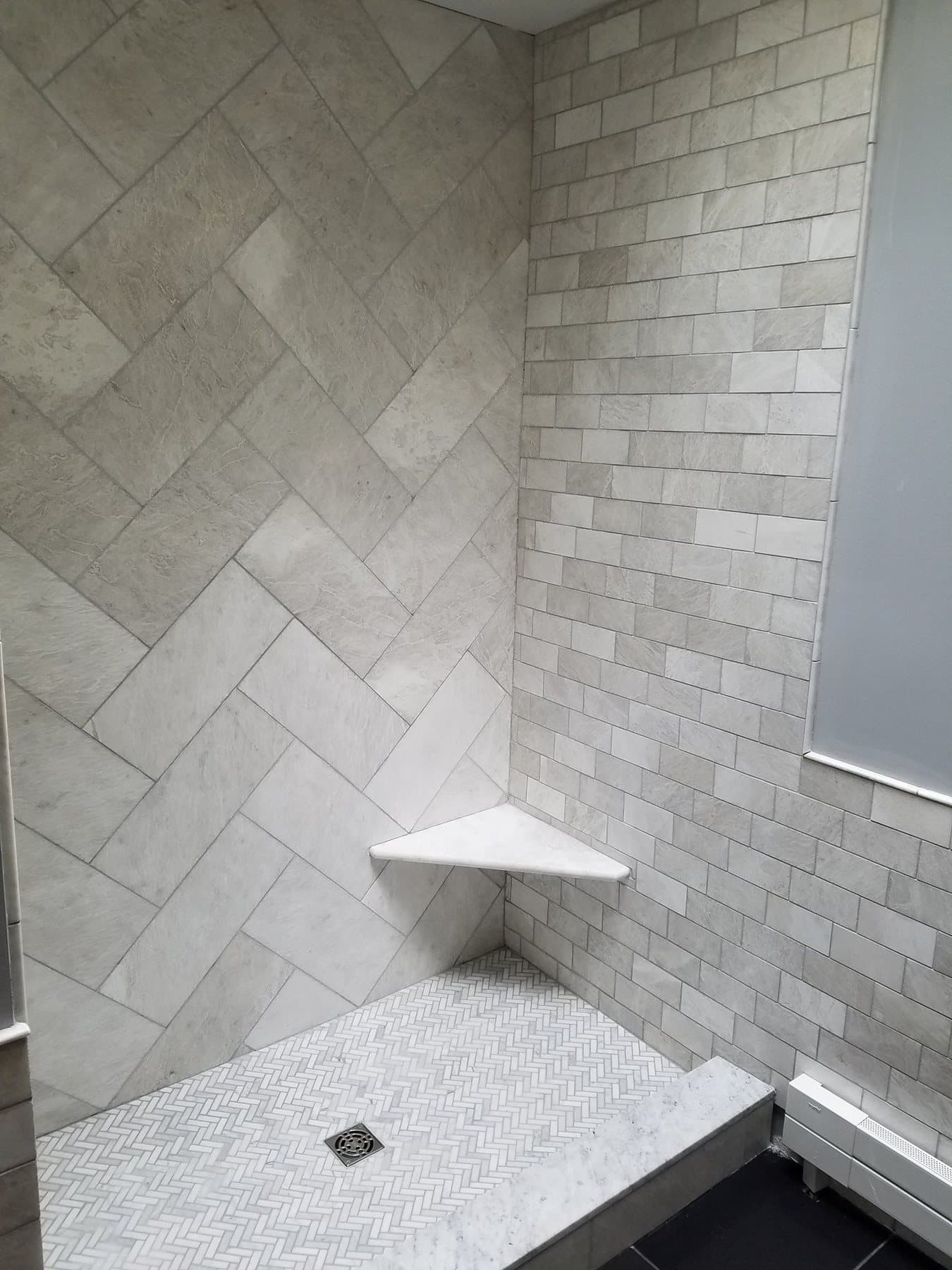 Tile shower with a bench from a bathroom remodel in Doylestown, PA