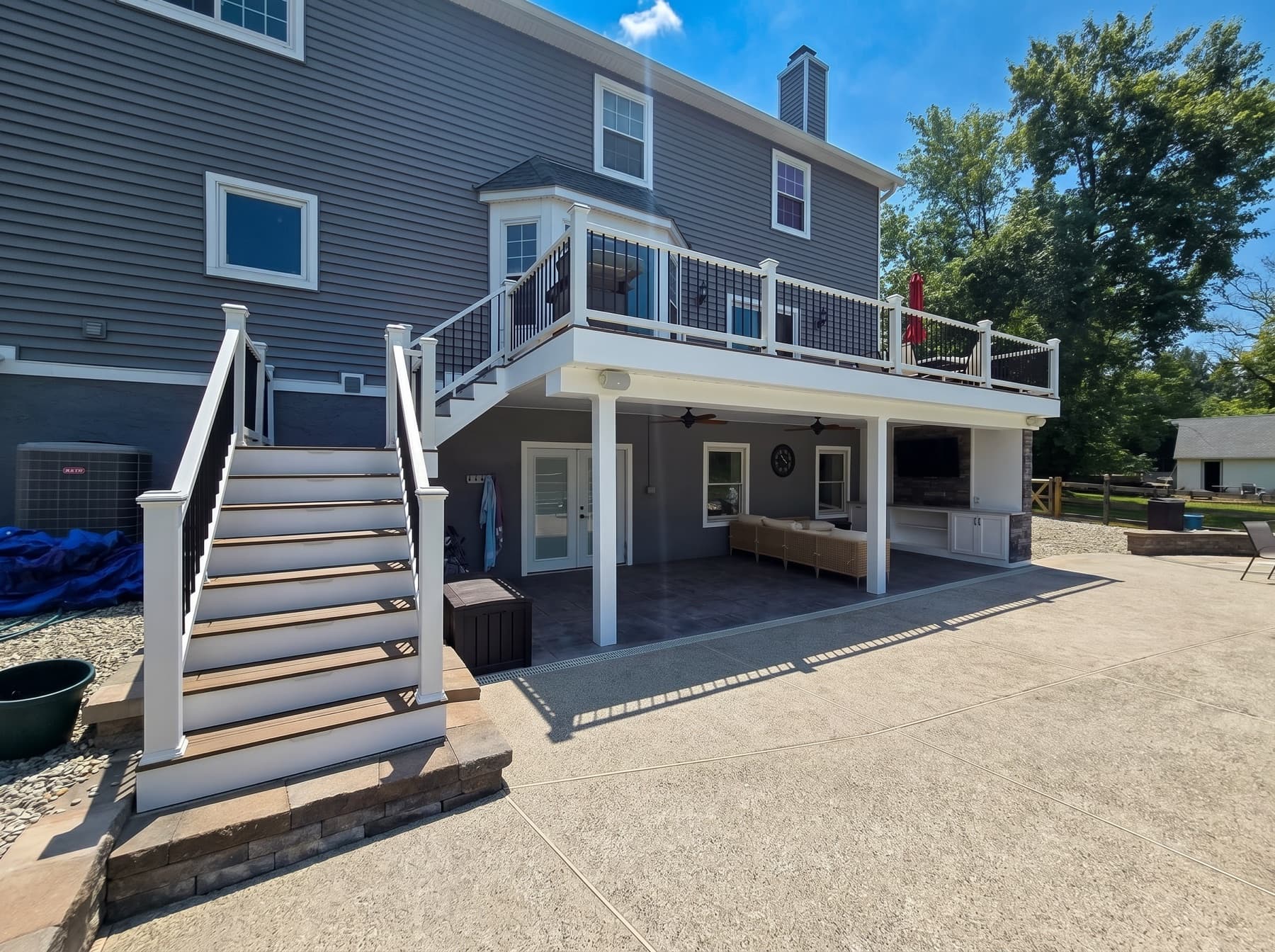Covered patio, stairs, and raised deck in Doylestown