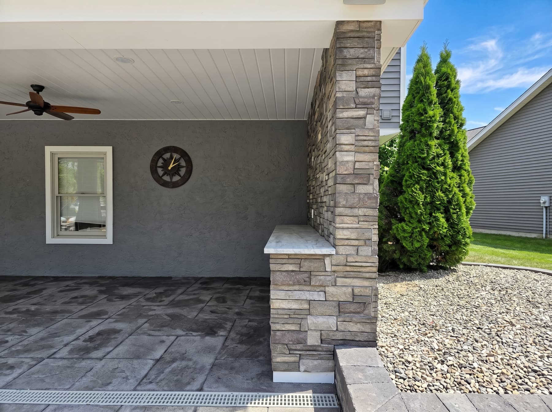 Stone column and covered patio from an outdoor living project in Doylestown, PA