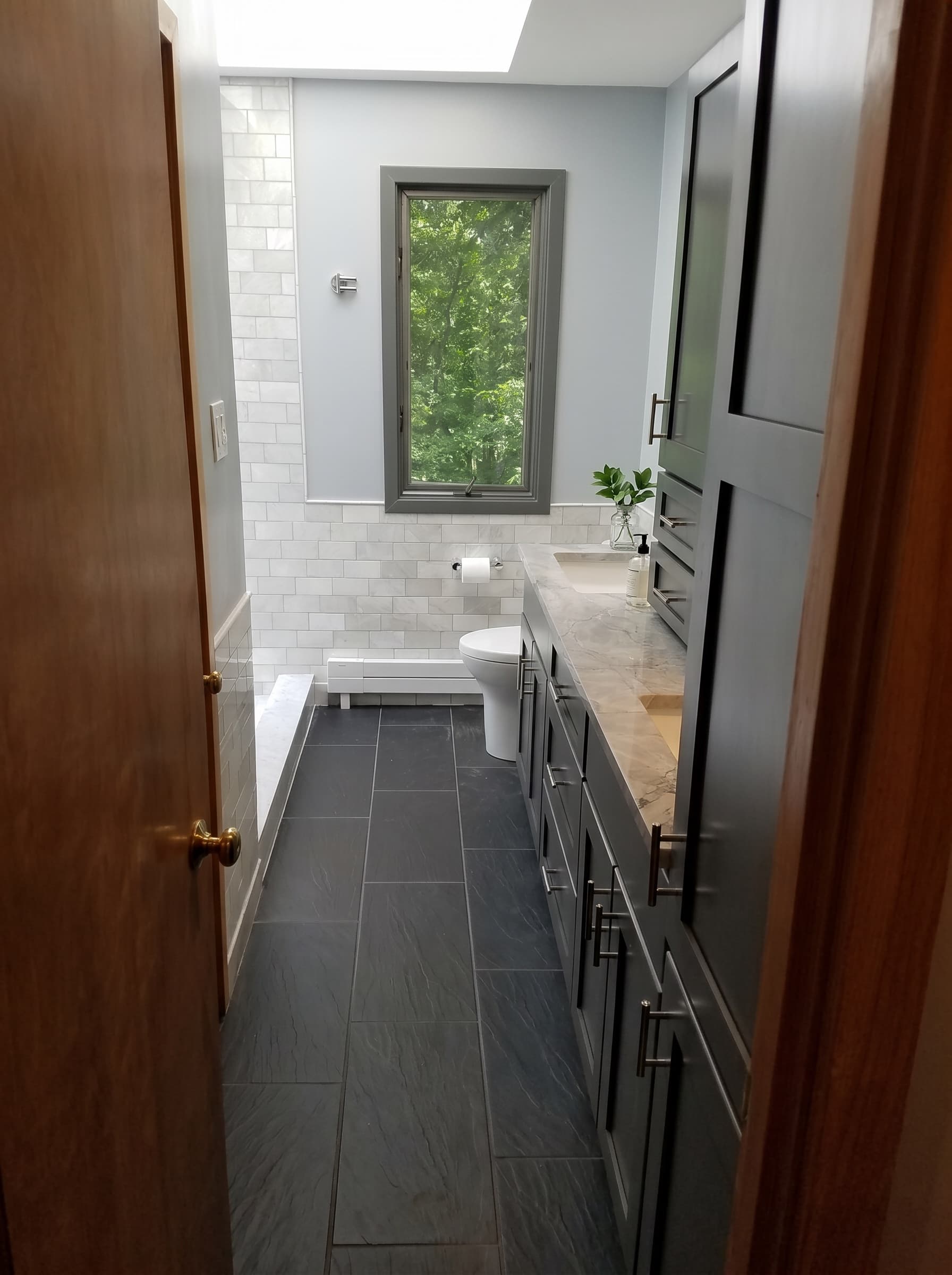 Finished Doylestown bathroom with dark floor tile