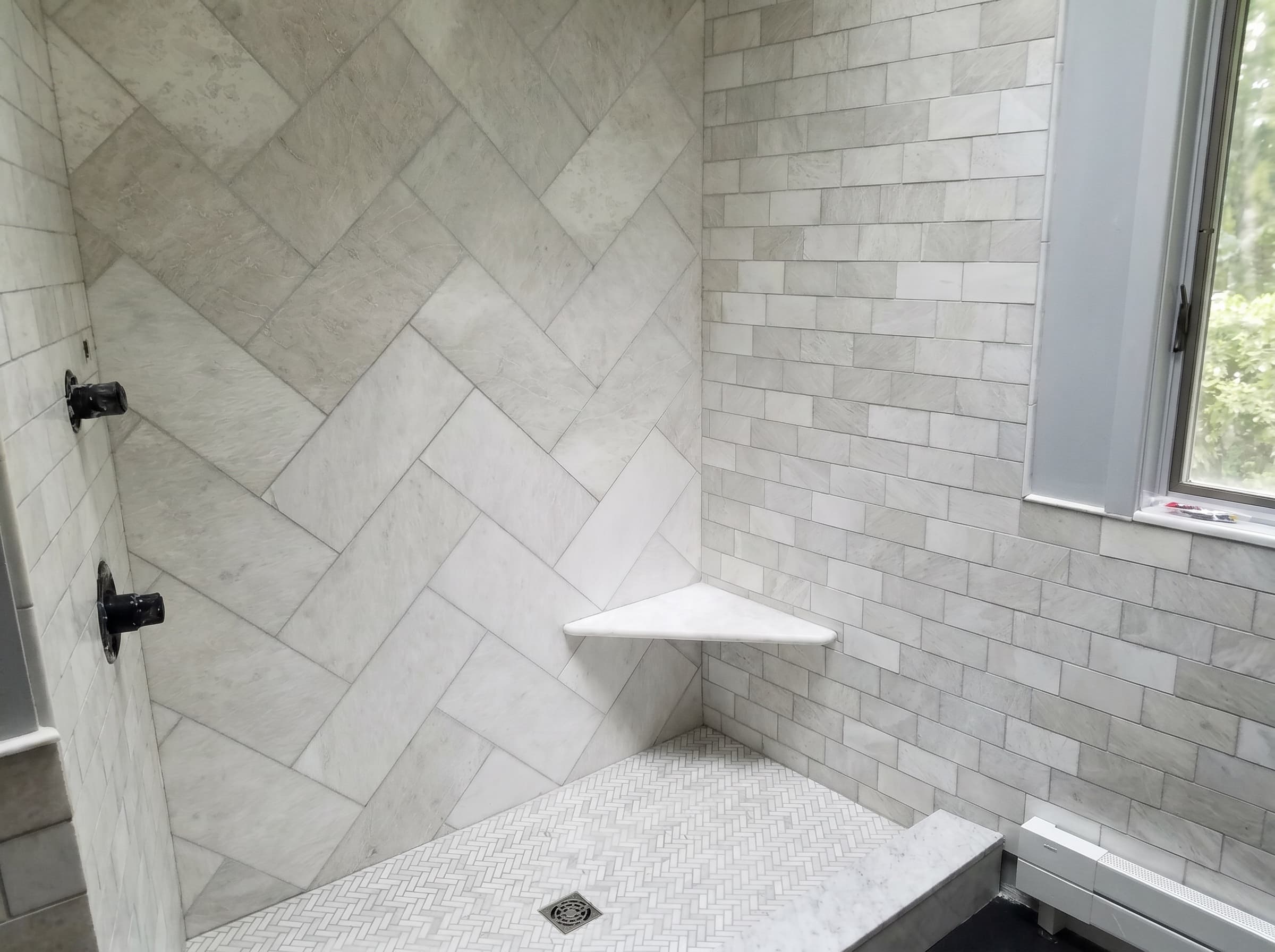 Finished Doylestown full bathroom shower with marble-look tile