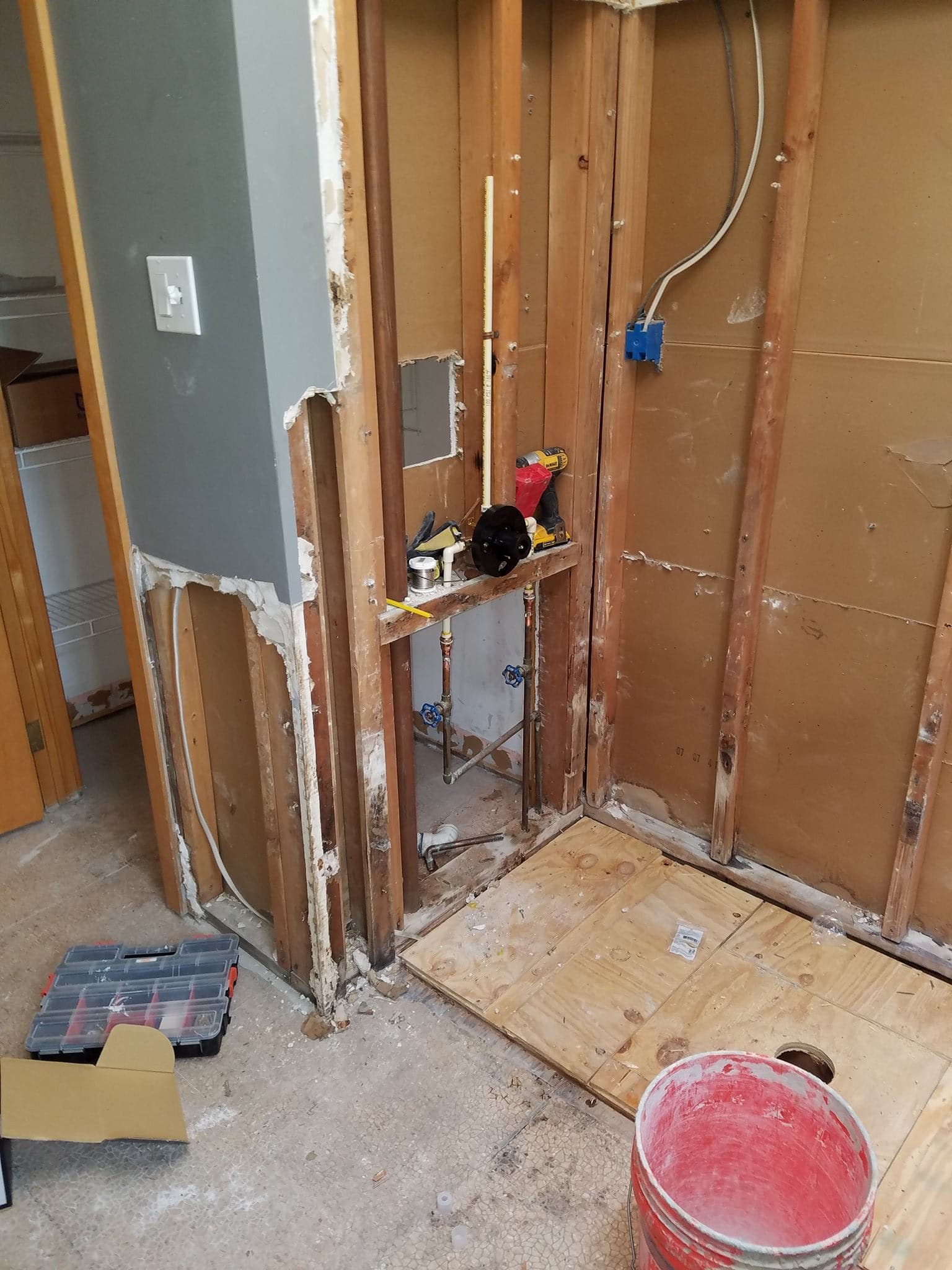 Plumbing rough-in with the walls open during a Doylestown bathroom remodel