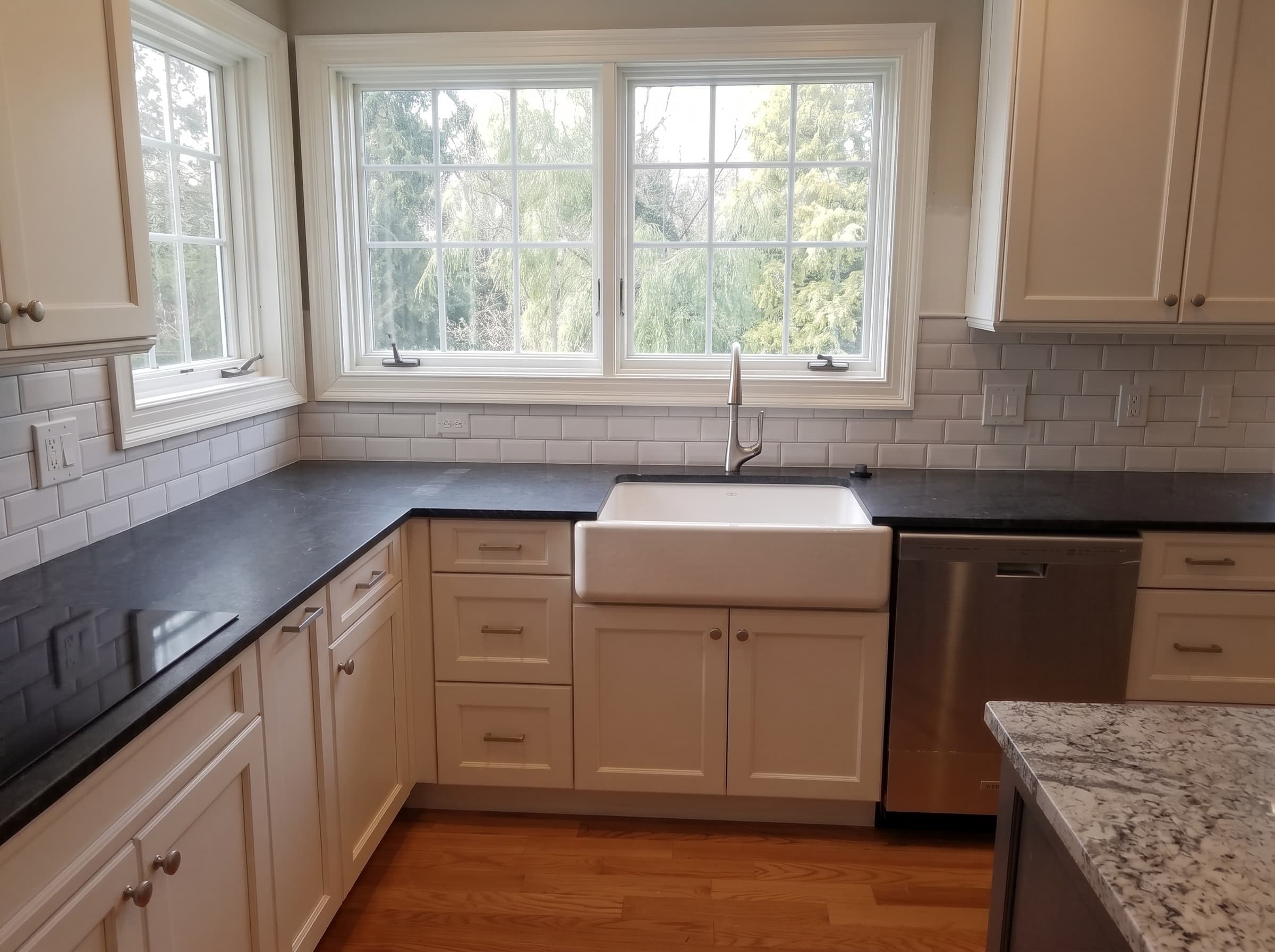 Subway tile backsplash and farmhouse sink in a Doylestown kitchen