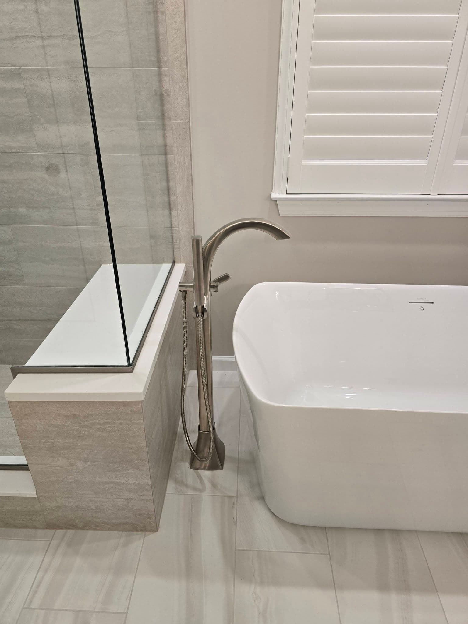 Freestanding tub and glass shower from a bathroom remodel in New Hope, PA