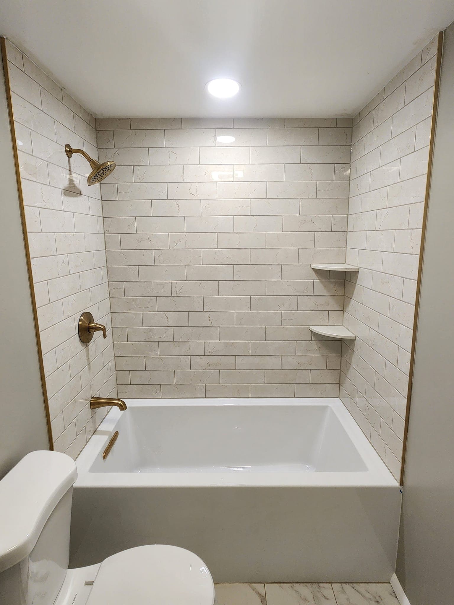 Updated tub and shower tile from a Warrington bathroom remodel