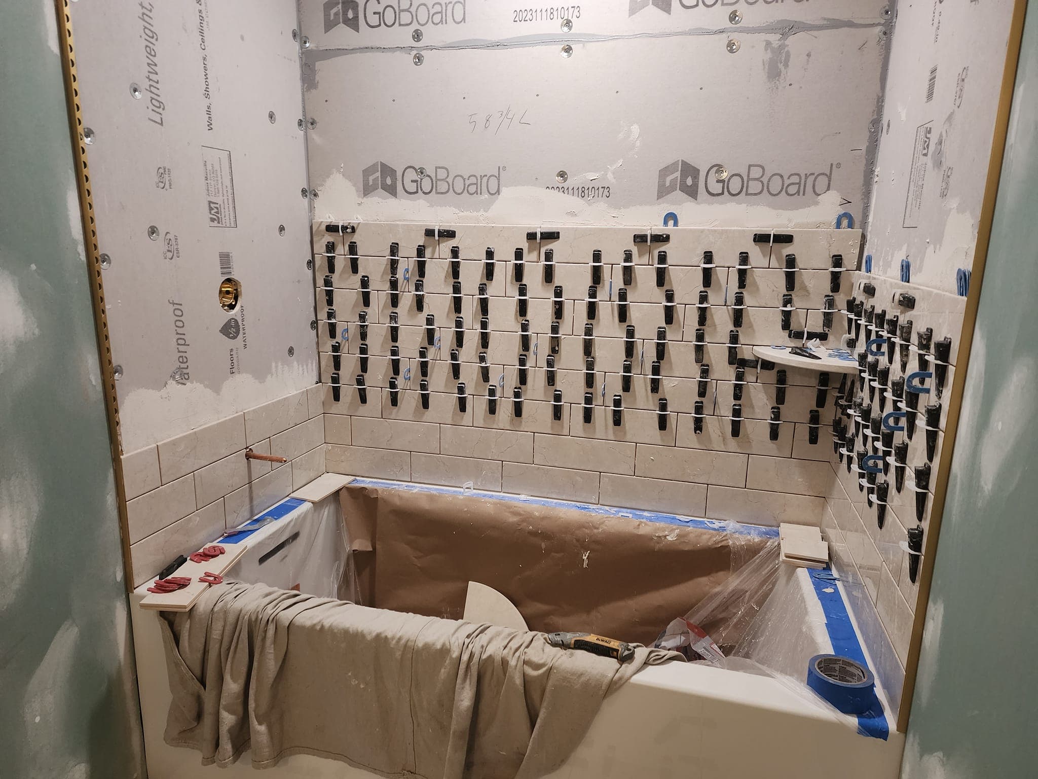 Shower tile going in during a Warrington bathroom remodel