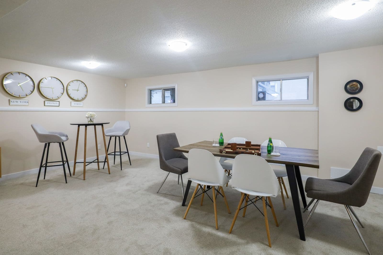 Finished basement with a dining and game area, carpet, and recessed lighting