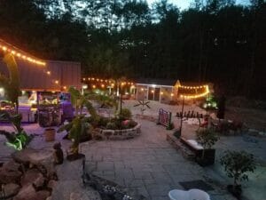 Outdoor patio area covered with nice lighting